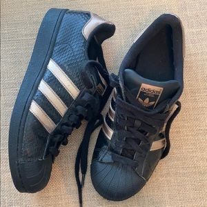 black and rose gold shell toe